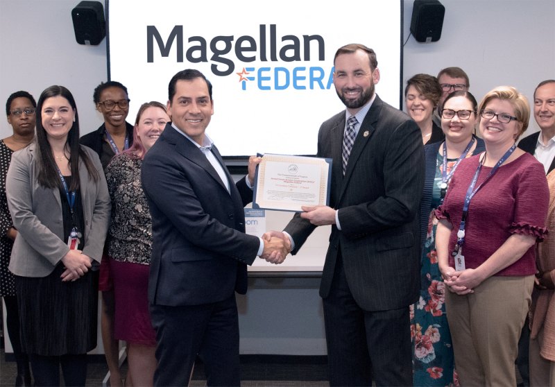 Magellan Federal Achieves V3 Certification On February 11, 2020, Magellan Federal was awarded V3 certification from Virginia Values Veterans for our public commitment to hire veterans. The ceremony took place at Magellan Federal’s Arlington, VA headquarters office, and was presented by V3 Regional Program Manager, Kenneth Lyles on behalf of Virginia Governor, Ralph Northam. The V3 program helps employers develop and implement long-term strategies and nationally recognized best practices in recruiting, hiring, and retaining Veterans. The program has 1,000+ certified companies and 55,000+ veterans hired. “We have always been committed to hiring veterans, and now I am thrilled to have greater access to a wide variety of industries to network and share best practices for increasing career opportunities for those that have served,” said Magellan Federal CEO, Oscar Montes.